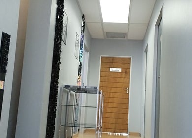 Elegant corridor at Lin-Glazed Beauty, Centurion, Gauteng, ZA with sleek walls and wooden doors.