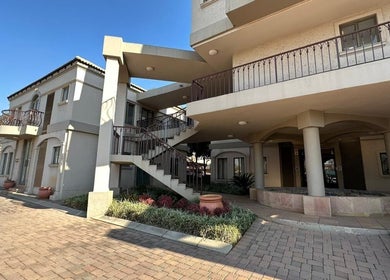 Exterior view of Lin-Glazed Beauty, Centurion, Gauteng, ZA, featuring modern architecture and lush landscaping.