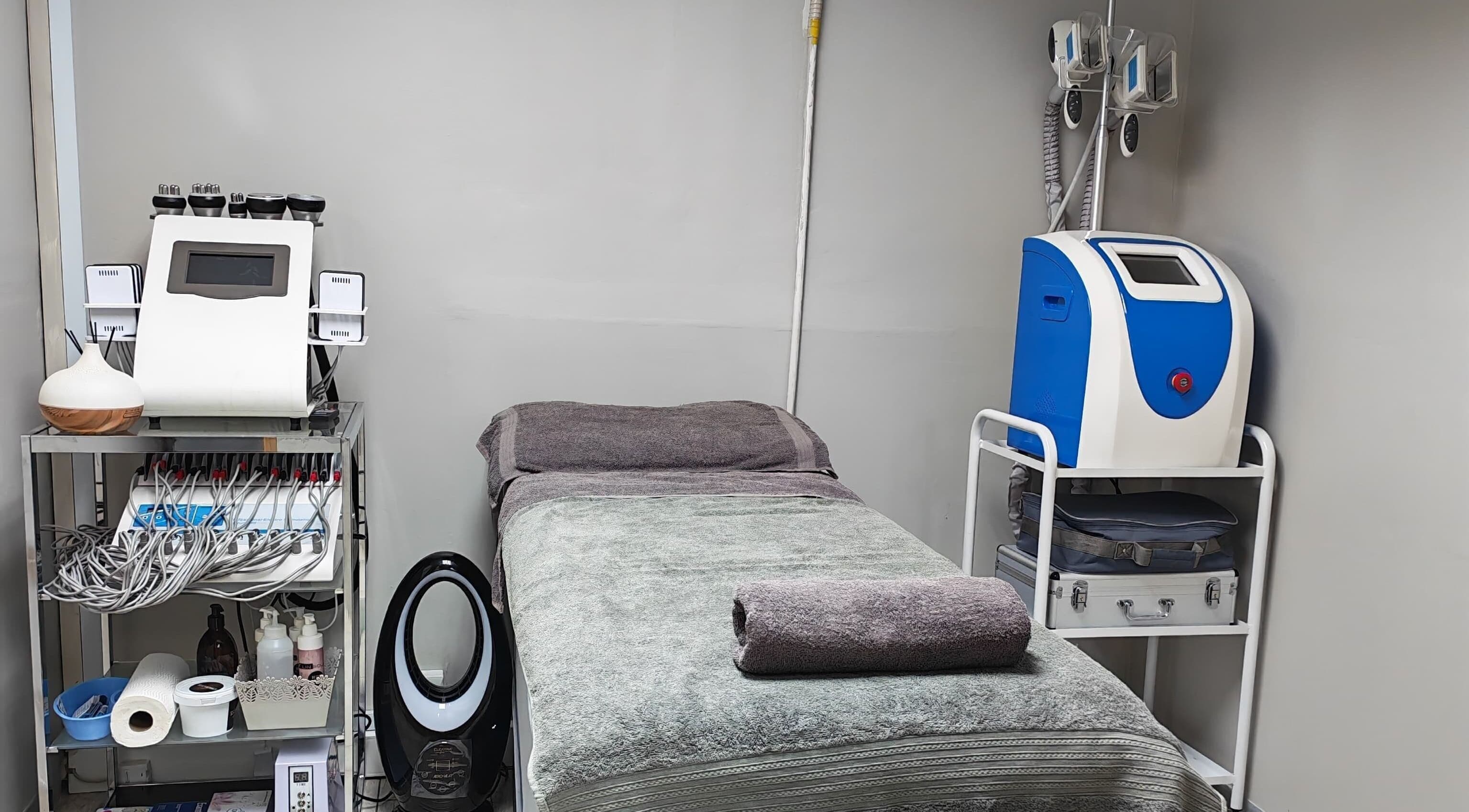 Spa room at Lin-Glazed Beauty, Centurion, Gauteng, ZA with treatment bed and equipment.