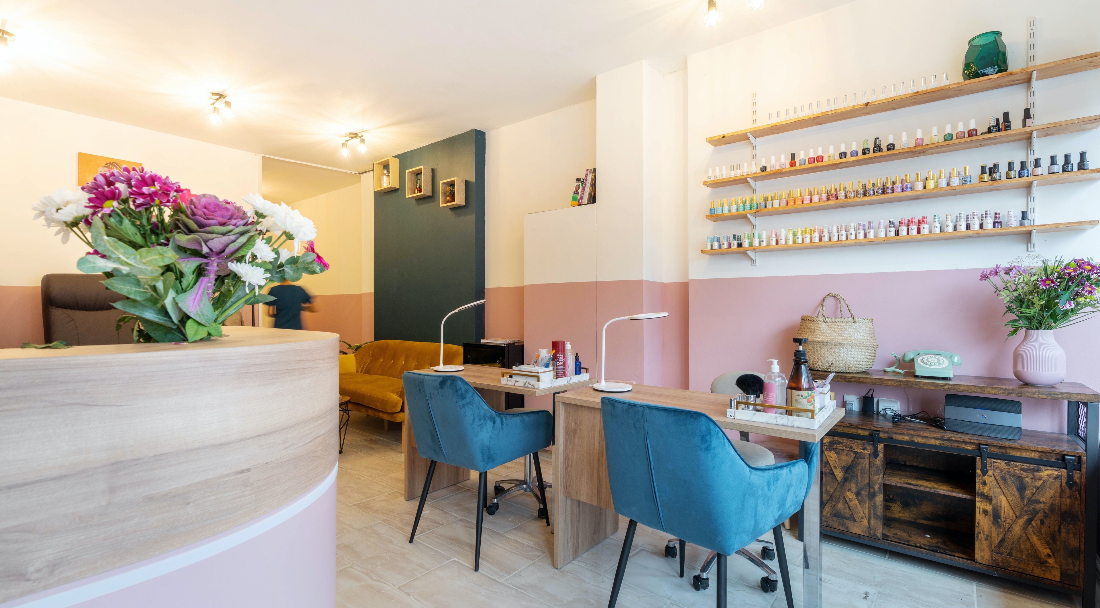 Stylish salon interior at Mazal Beauty and Wellness, London, England, GB with elegant decor and nail polish display.