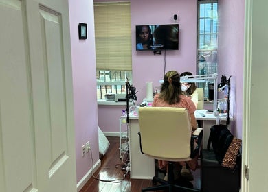 Millennium Beauty Studio interior workspace, New York, New York, US, featuring treatment area and decor.