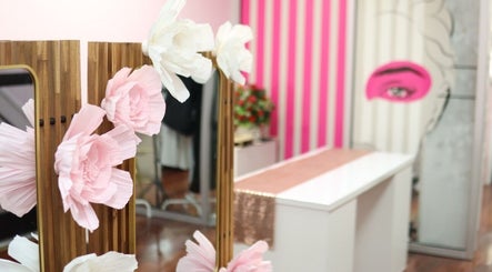 Decorative mirror with pink flowers at Millennium Beauty Studio, New York, New York, US.