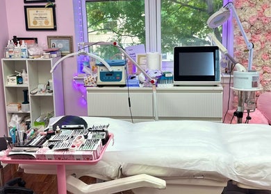 Treatment room at Millennium Beauty Studio, New York, New York, US, featuring tools and floral decor.
