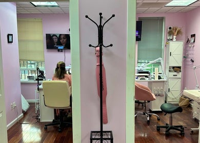 Modern interior of Millennium Beauty Studio, New York, New York, US, featuring cozy seating and stylish decor.