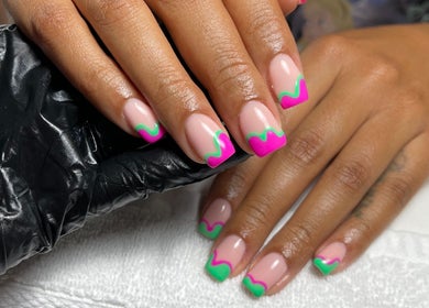 Colorful nail design at Beck the Nail Teck in Dartford, GB showcasing vibrant pink and green tips.