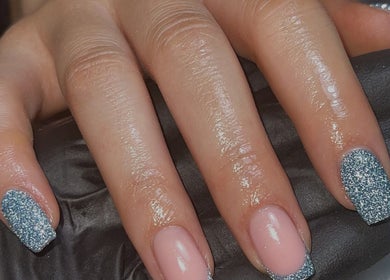 Sparkling blue glitter manicure at Beck the Nail Teck in Dartford, GB, showcasing detailed nail artistry.
