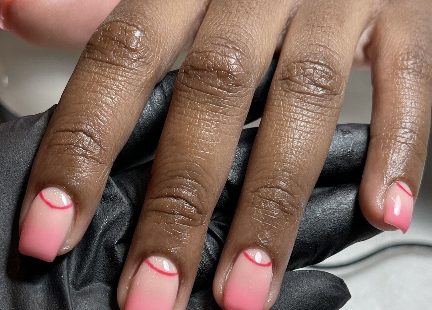 Stylish pink nails with unique design at Beck the Nail Teck, Dartford, GB.