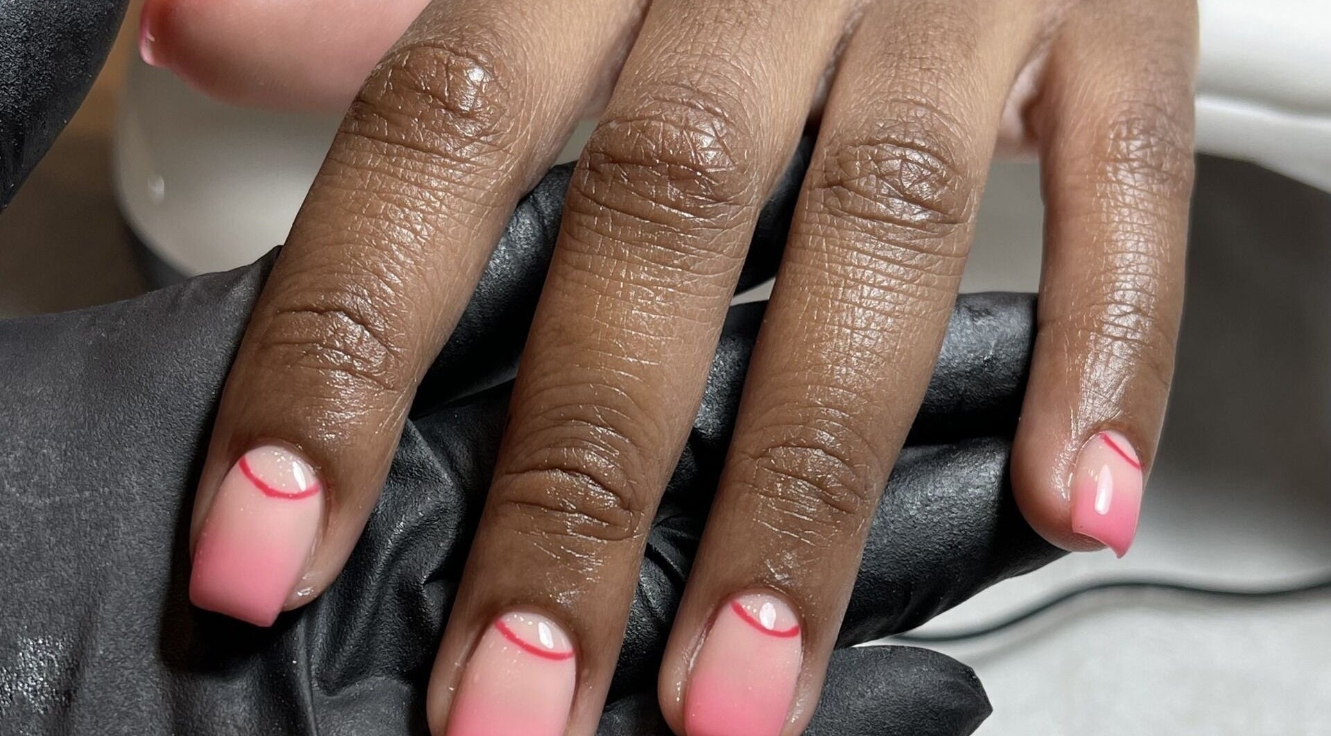 Stylish pink nails with unique design at Beck the Nail Teck, Dartford, GB.