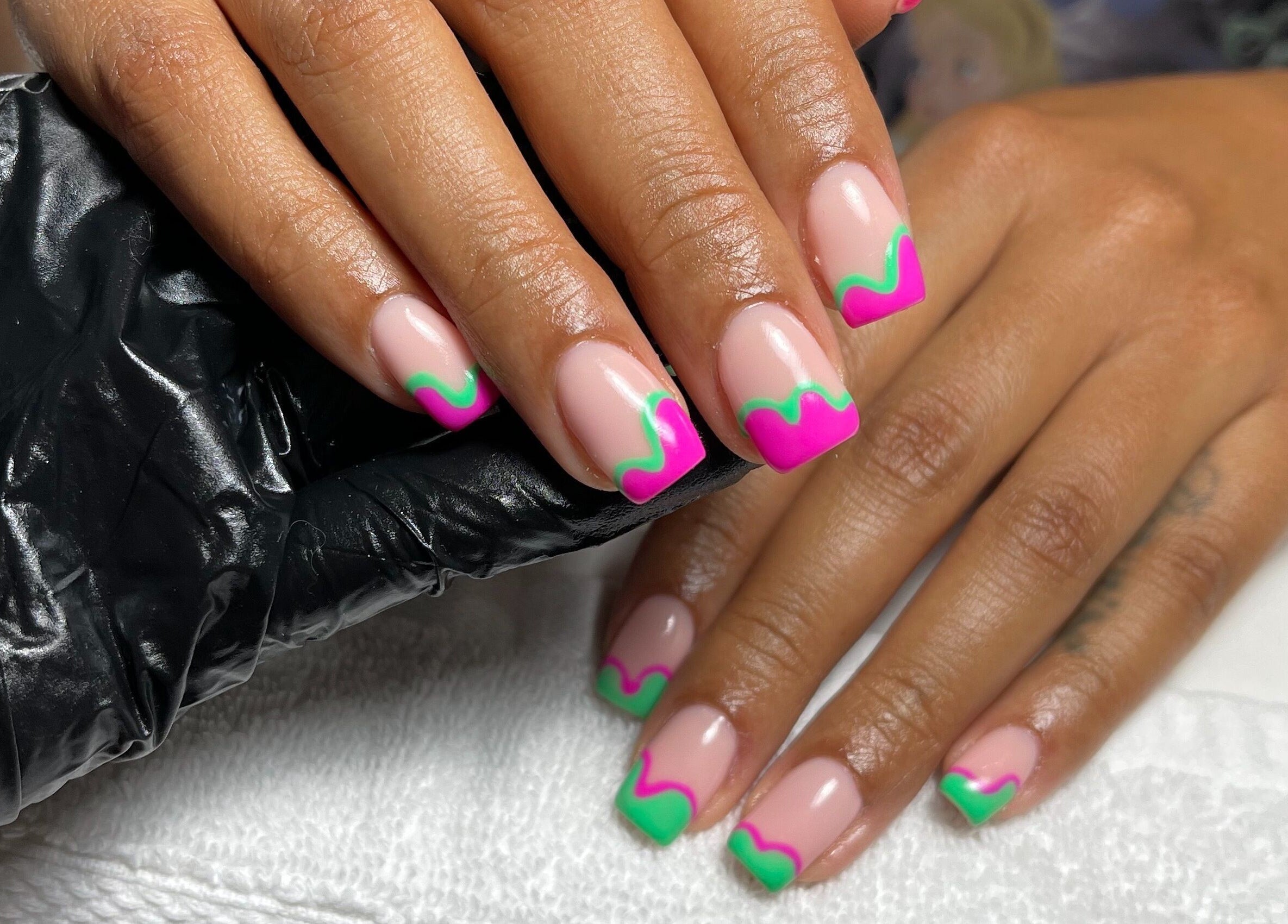 Vibrant neon nail art at Beck the Nail Teck, Dartford, GB. Pink and green design on a client's nails.