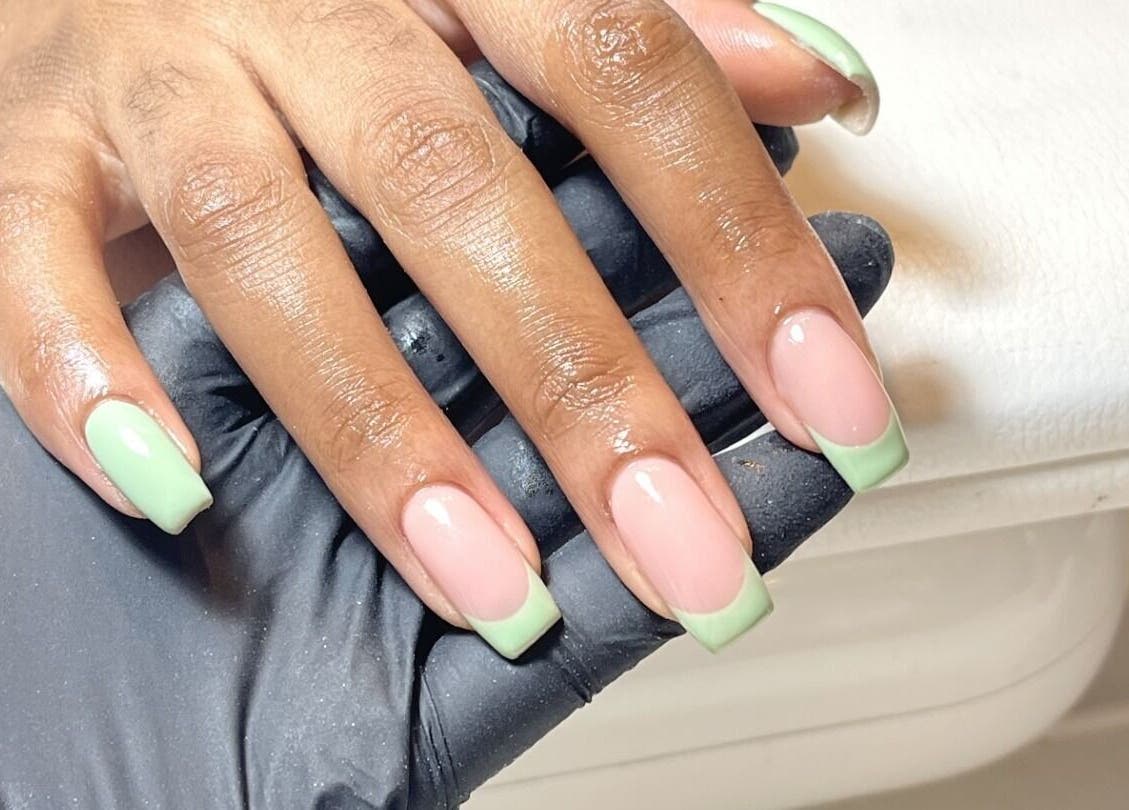 Elegant mint green French manicure at Beck the Nail Teck, Dartford, GB. Perfect nail art for any occasion.
