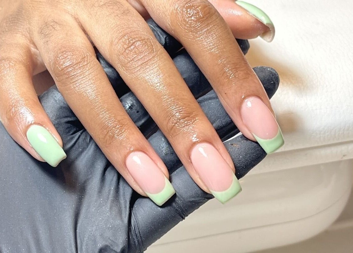 Elegant mint green French manicure at Beck the Nail Teck, Dartford, GB. Perfect nail art for any occasion.