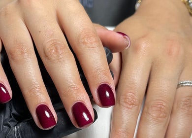 Elegant maroon manicure at Beck the Nail Teck, Dartford, GB showcases luxury nail art.