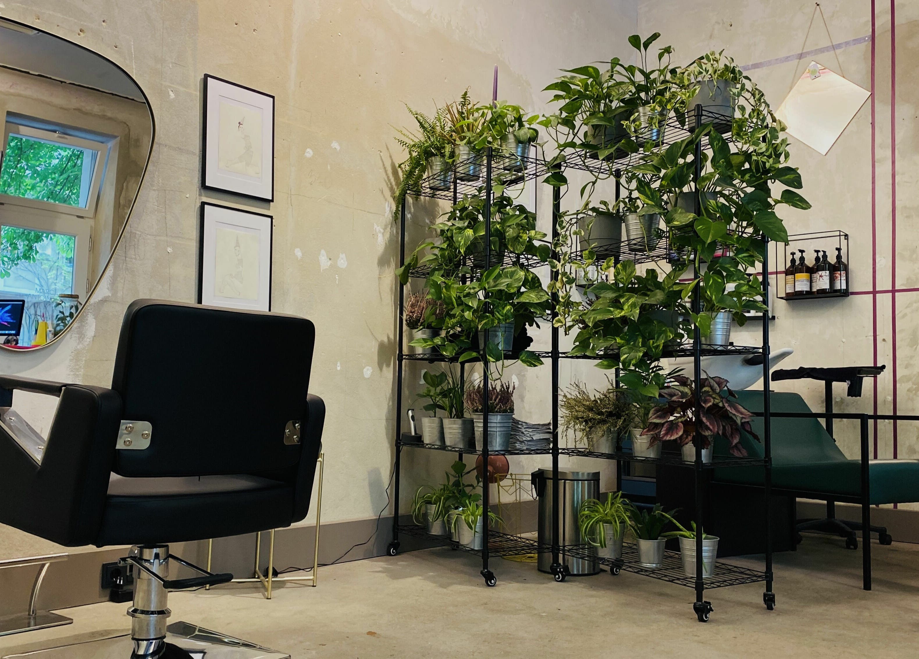 Modern salon interior at Marc-Antoine Hairstudio Gallery, Berlin, Berlin, DE with chic decor and greenery.