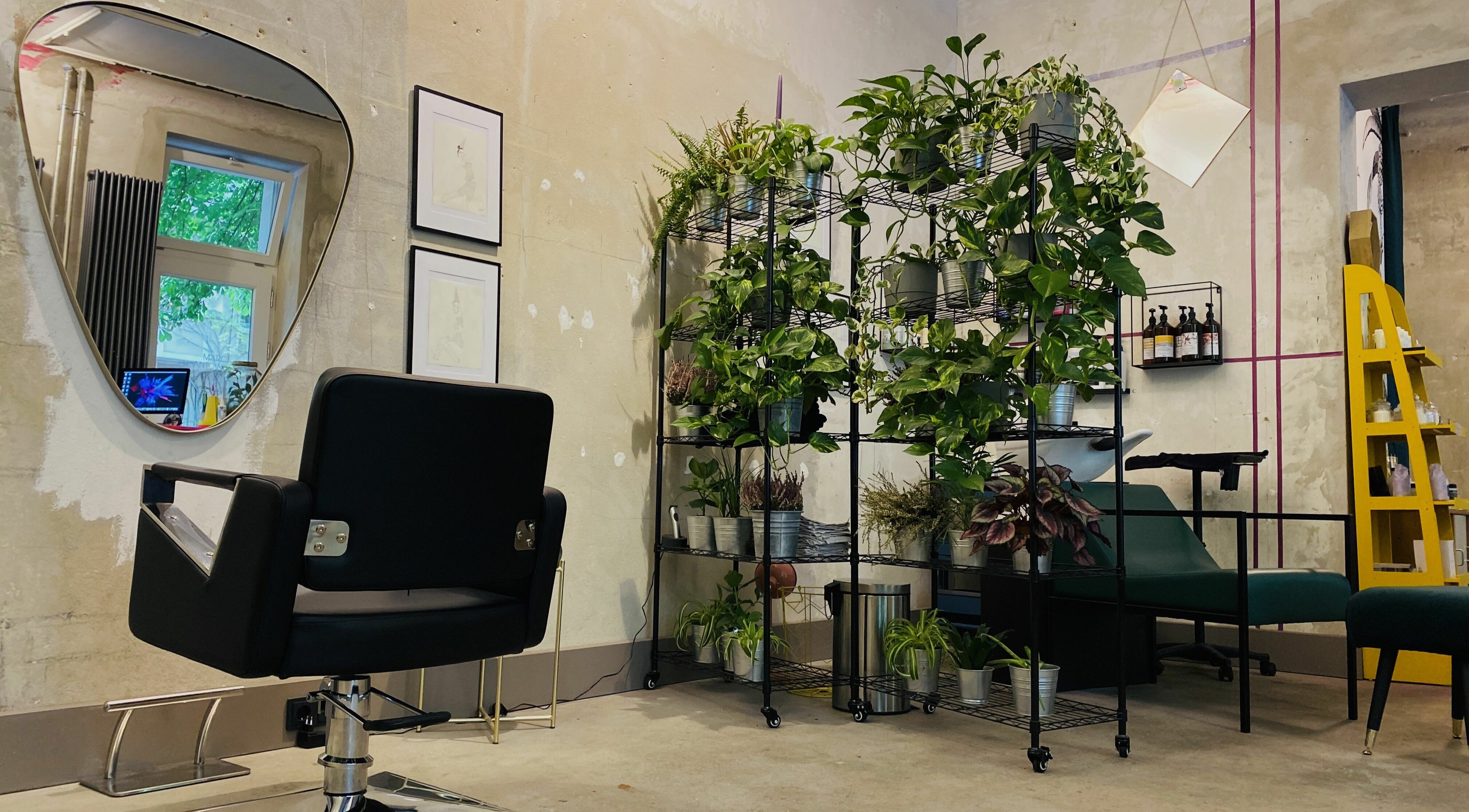 Modern salon interior at Marc-Antoine Hairstudio Gallery, Berlin, Berlin, DE with chic decor and greenery.