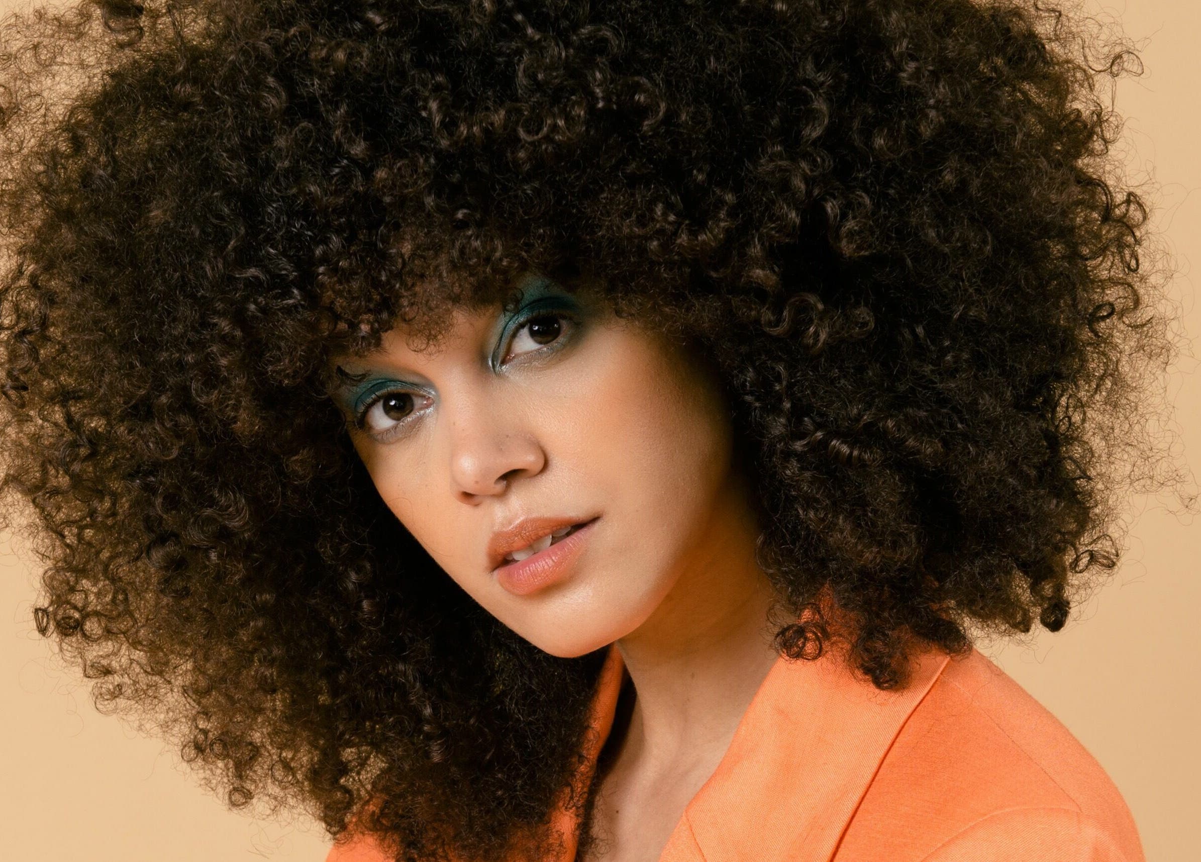 Stylish woman with curly hair at Marc-Antoine Hairstudio Gallery, Berlin, Berlin, DE.