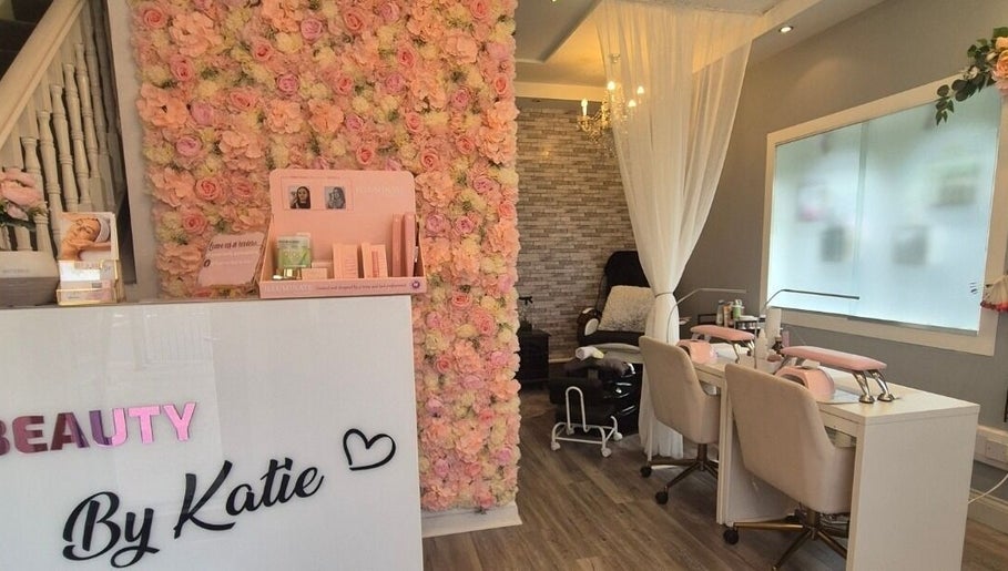 Beauty and Body By Katie in Castleisland, County Kerry, IE showcases a floral wall and modern salon seating.