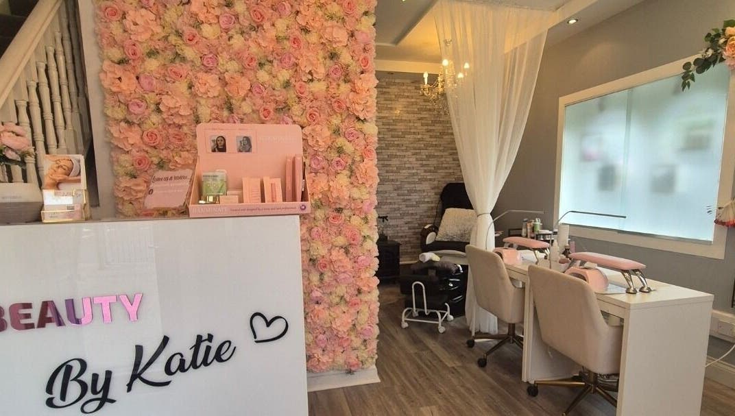 Beauty and Body By Katie in Castleisland, County Kerry, IE showcases a floral wall and modern salon seating.
