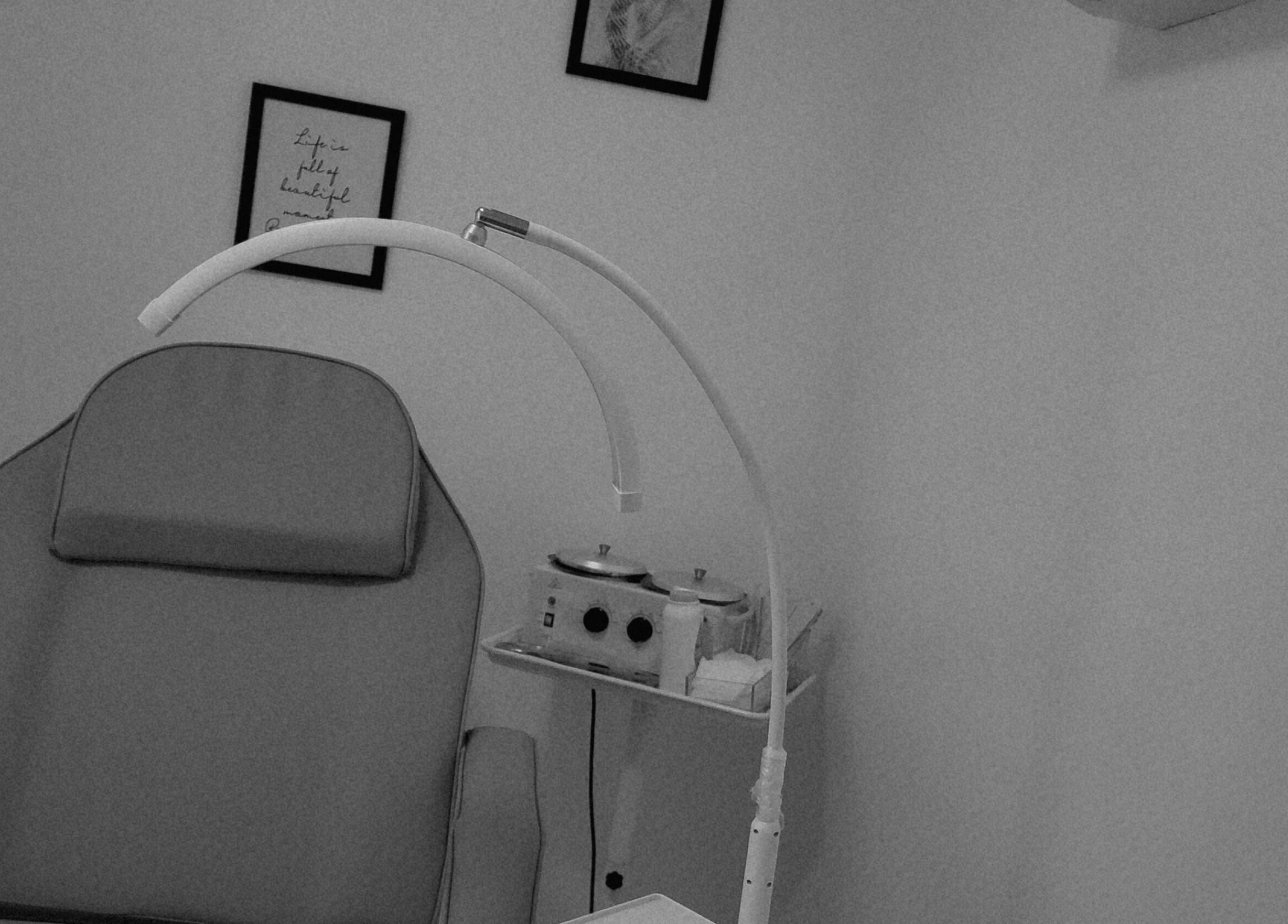 Ndya's Beauty Loft spa room with treatment chair in Nassau, New Providence, BS. Minimalist and soothing decor.