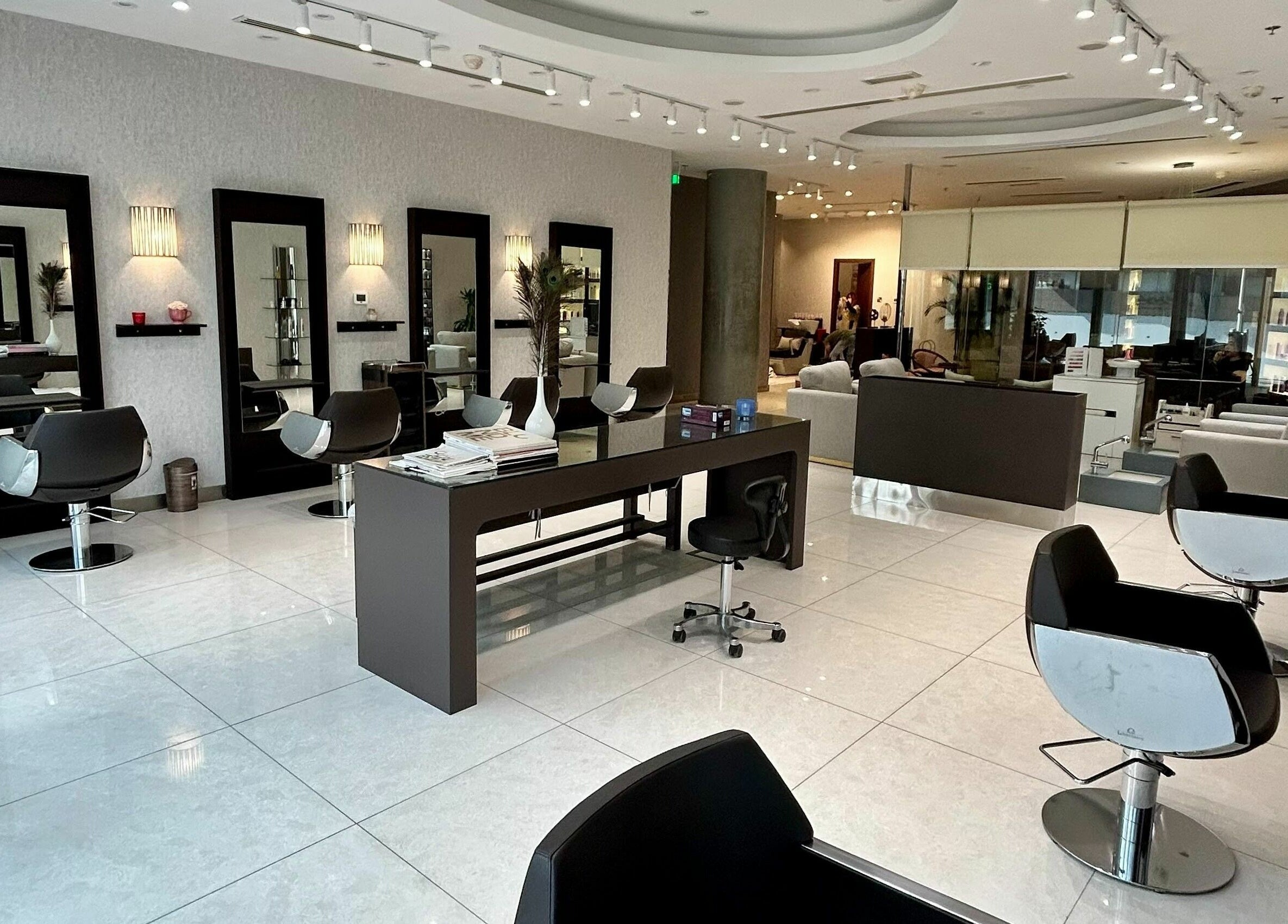Modern interior of Venere By Ann Ladies Salon, Abu Dhabi, AE showcasing stylish salon chairs and mirrors.