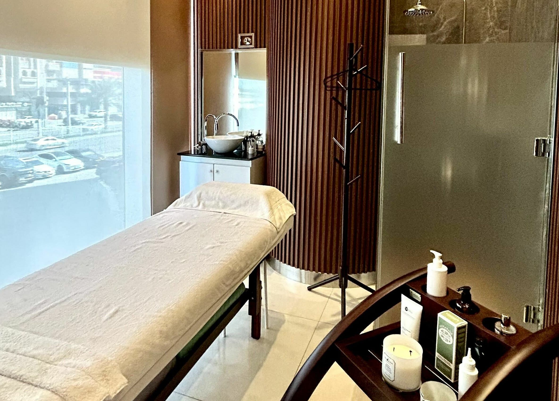 Tranquil treatment room at Venere By Ann Ladies Salon, Abu Dhabi, AE, featuring a massage table and spa essentials.
