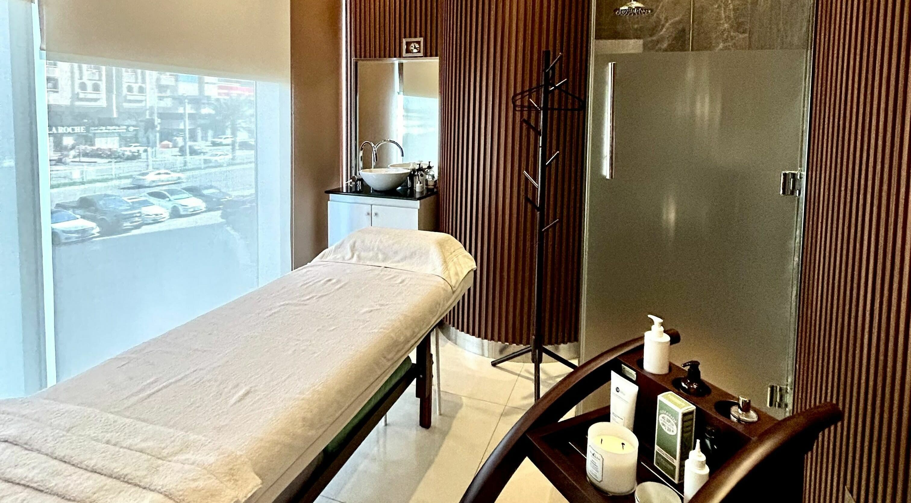 Tranquil treatment room at Venere By Ann Ladies Salon, Abu Dhabi, AE, featuring a massage table and spa essentials.