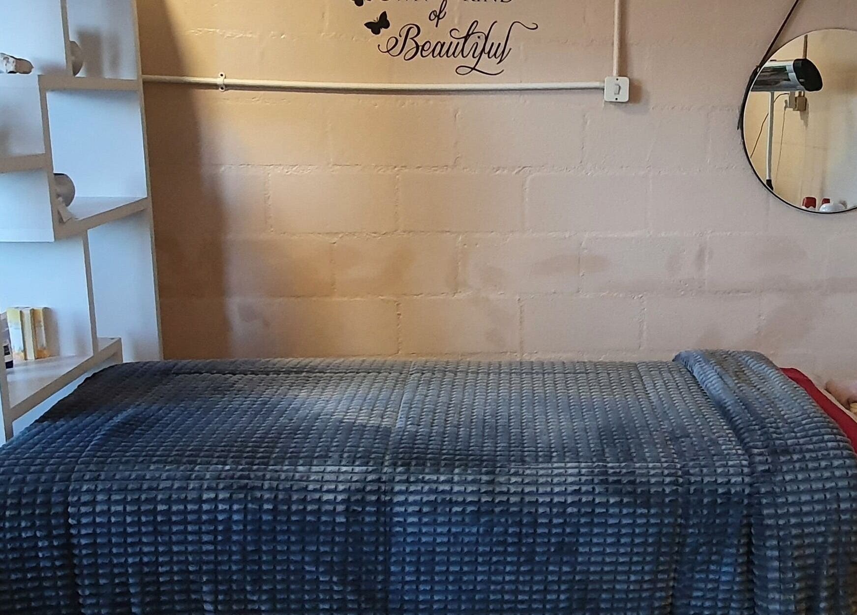 Relaxing treatment room at Sass Spa, Cape Town, Western Cape, ZA, featuring cozy bed and calming decor.