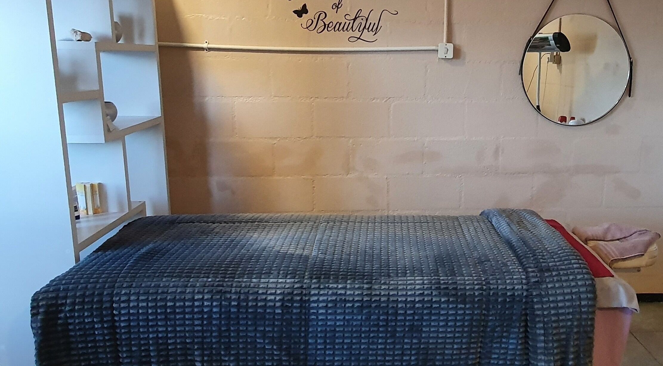 Relaxing treatment room at Sass Spa, Cape Town, Western Cape, ZA, featuring cozy bed and calming decor.