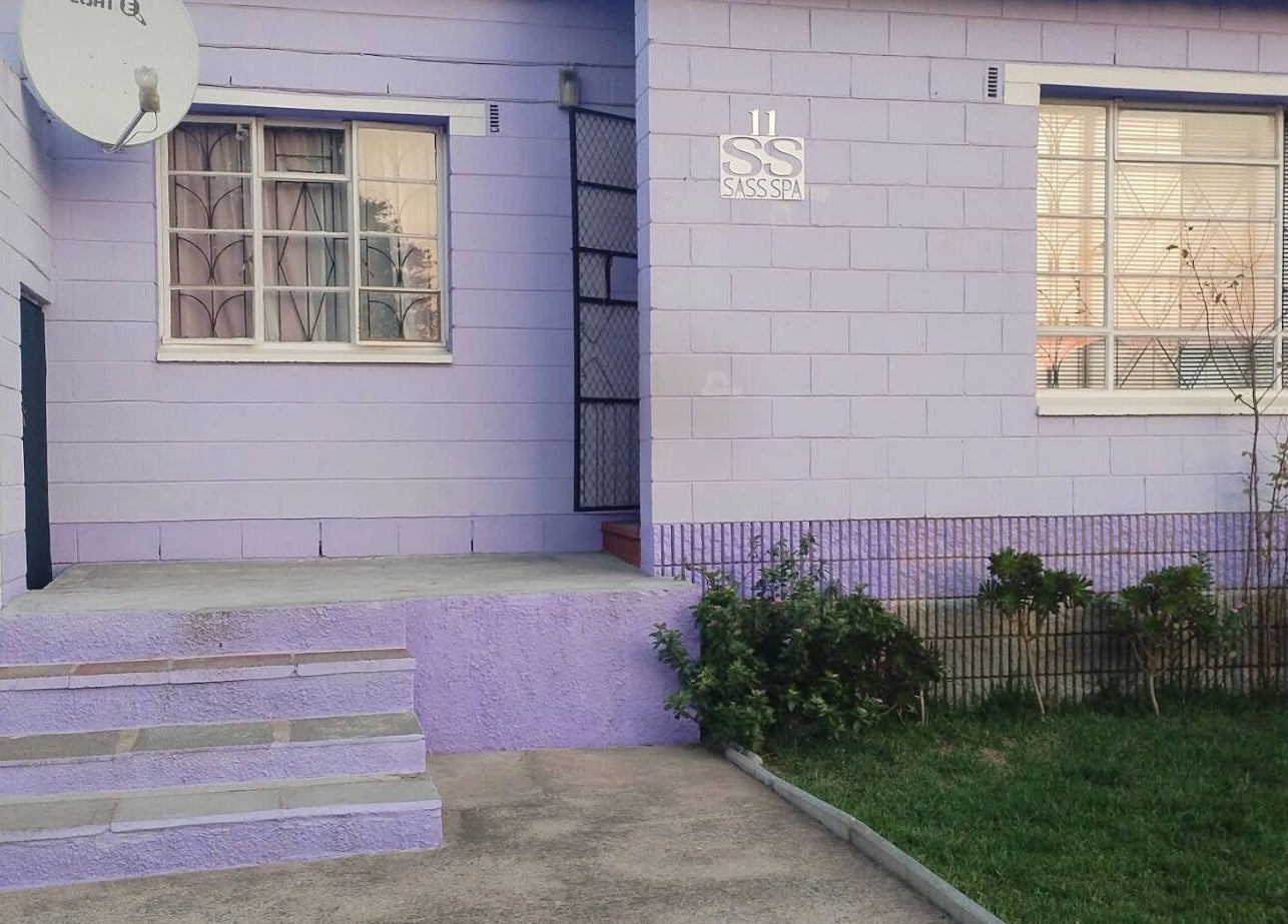 Front entrance of Sass Spa, a lavender-painted wellness venue in Cape Town, Western Cape, ZA.