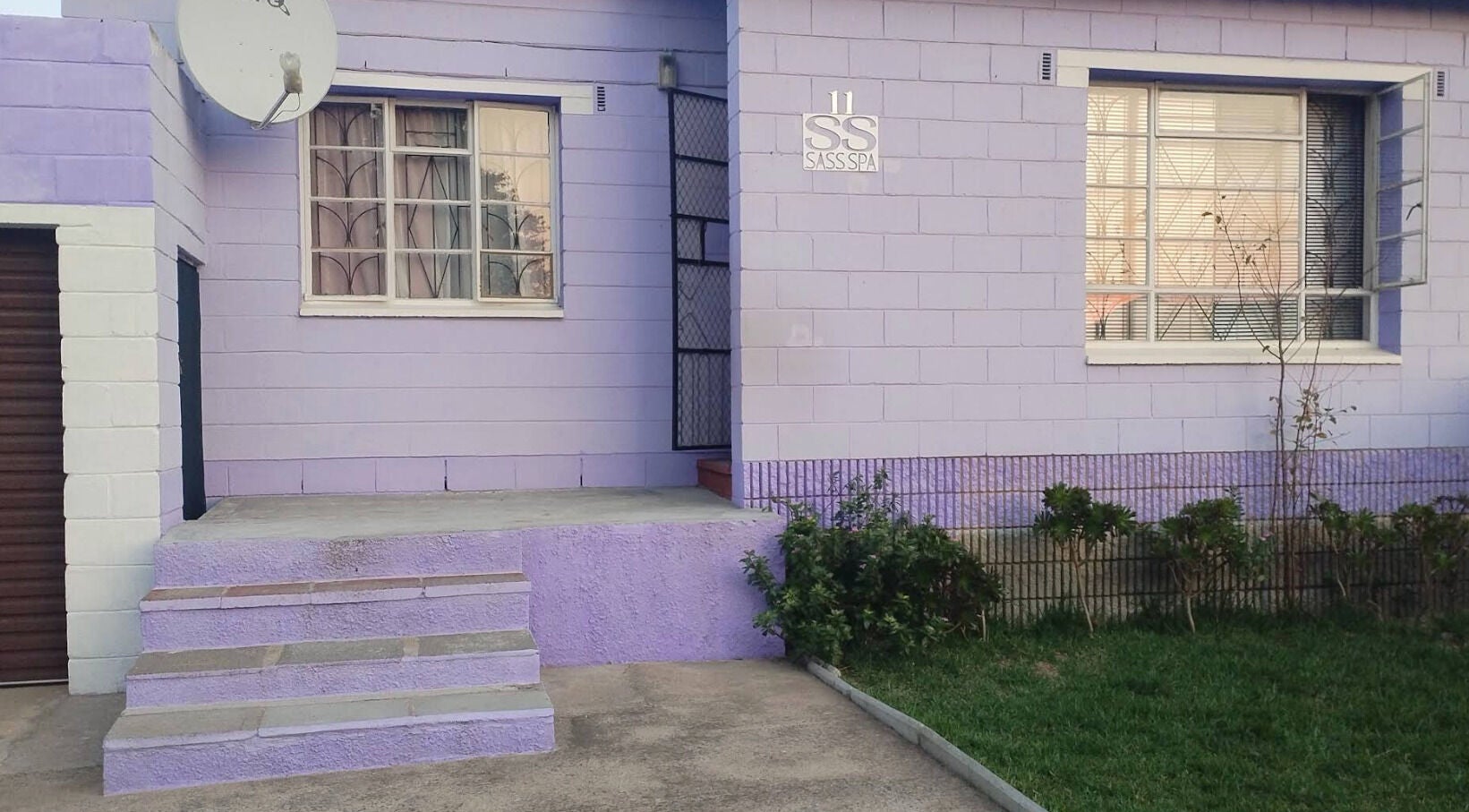 Front entrance of Sass Spa, a lavender-painted wellness venue in Cape Town, Western Cape, ZA.