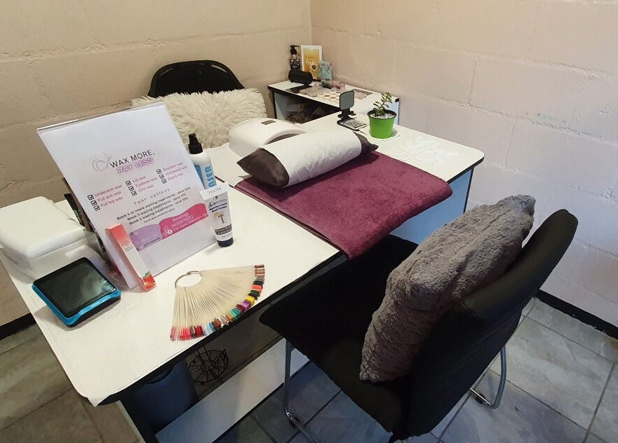 Nail station at Sass Spa in Cape Town, Western Cape, ZA, featuring a plush chair and organised tools.