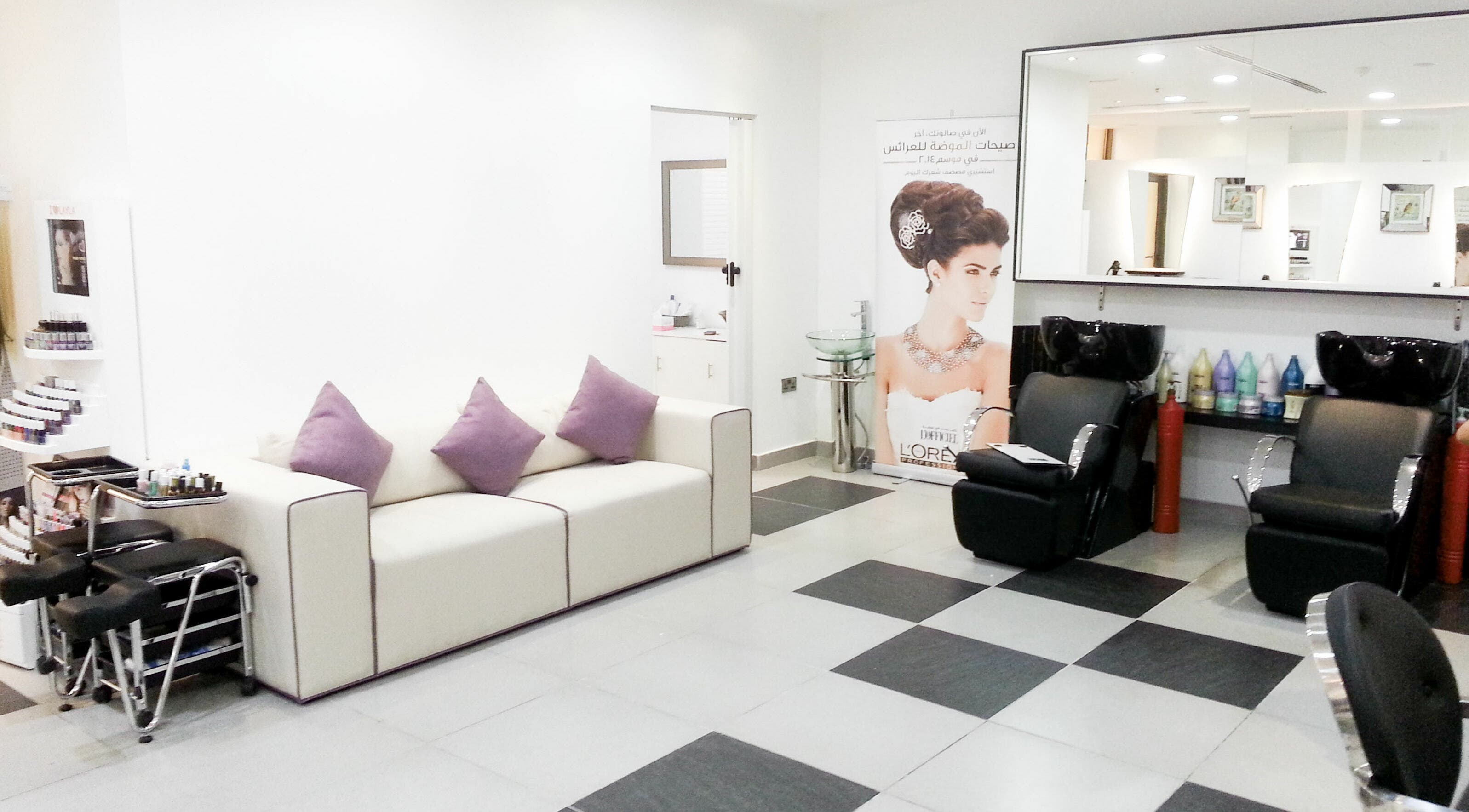 Stylish interior of MOI Beauty Salon - Ramada Hotel in Dubai, Dubai, AE with plush seating and modern decor.