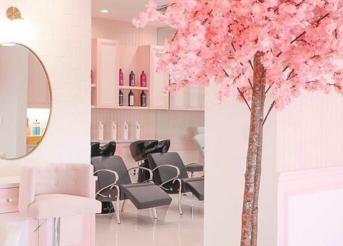 Elegant salon interior with pink blossom tree at Brows by Alyssa HairBae Beauty Bar, Los Angeles, California, US.