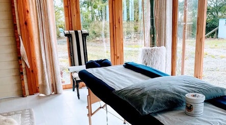 Bright massage room at Mobile Massage Pembrokeshire in Haverfordwest, Wales, GB, showcasing relaxation and tranquility.