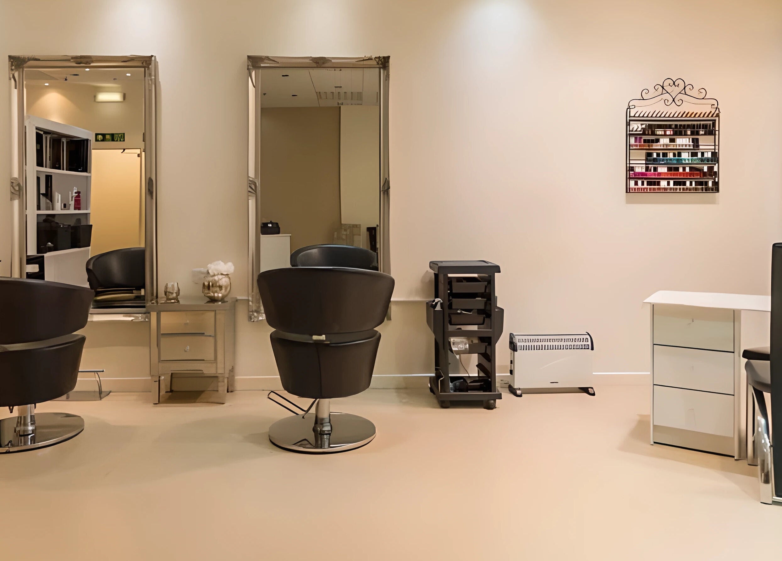 Modern salon interior at Pampered Retreat, Bangor, Wales, GB, featuring stylish chairs and mirrors.