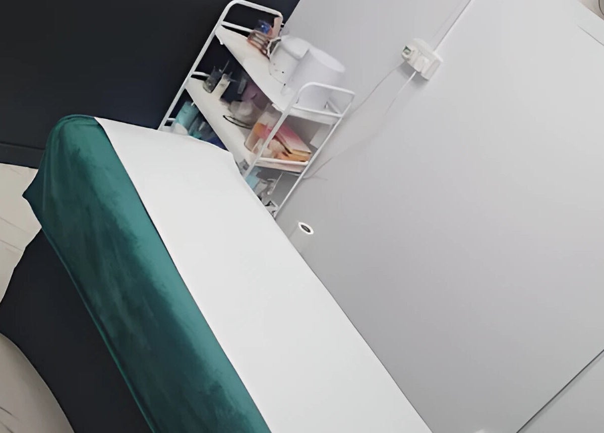 Relaxing therapy room at Pampered Retreat in Bangor, Wales, GB featuring a cozy massage bed.