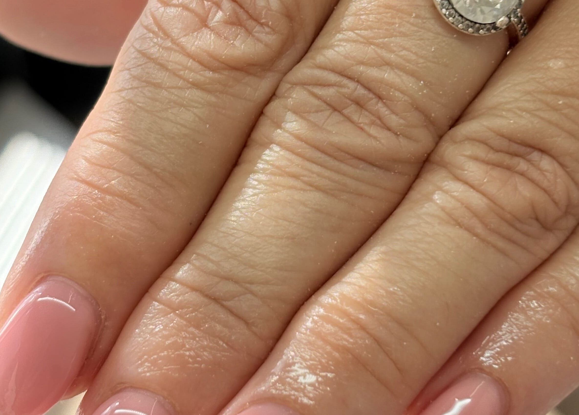 Elegant pink manicure with a diamond ring at The Bloom Studio, Colchester, England, GB.
