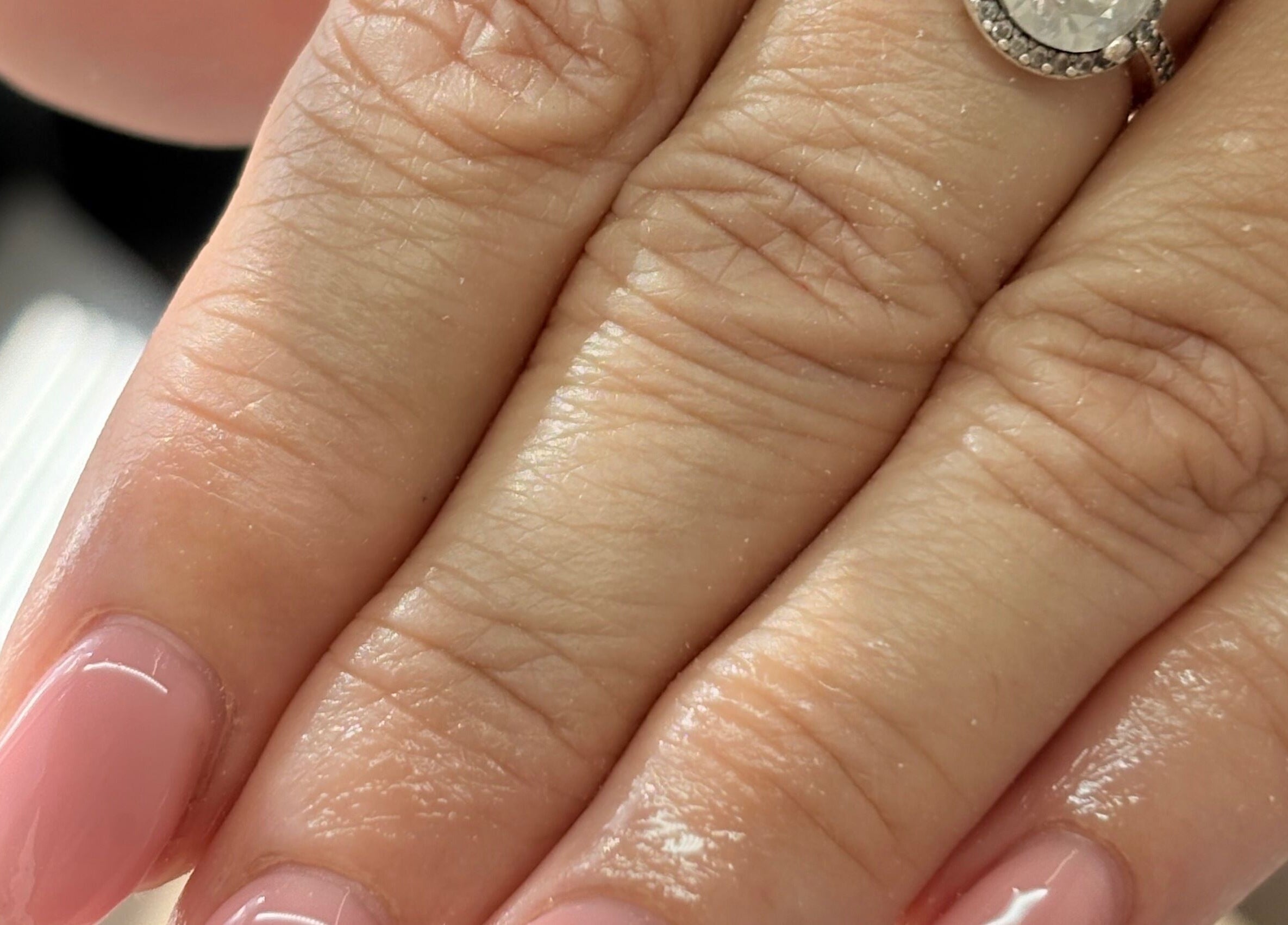 Elegant pink manicure with a diamond ring at The Bloom Studio, Colchester, England, GB.