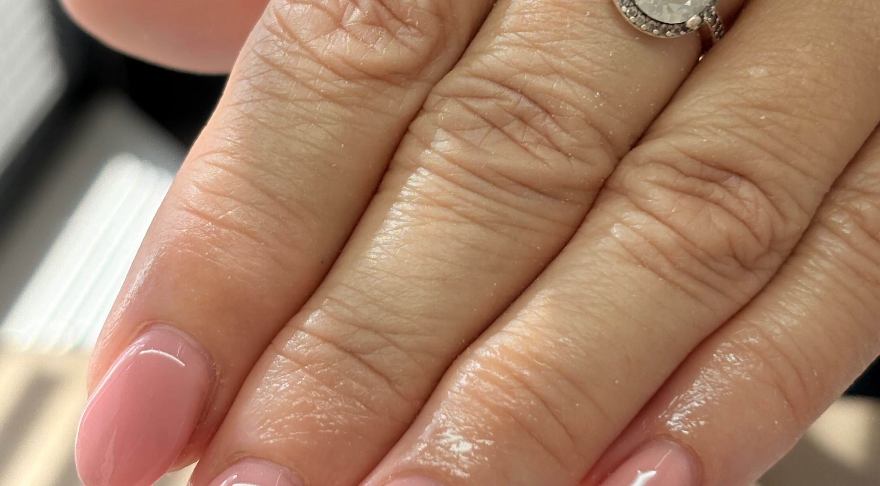 Elegant pink manicure with a diamond ring at The Bloom Studio, Colchester, England, GB.