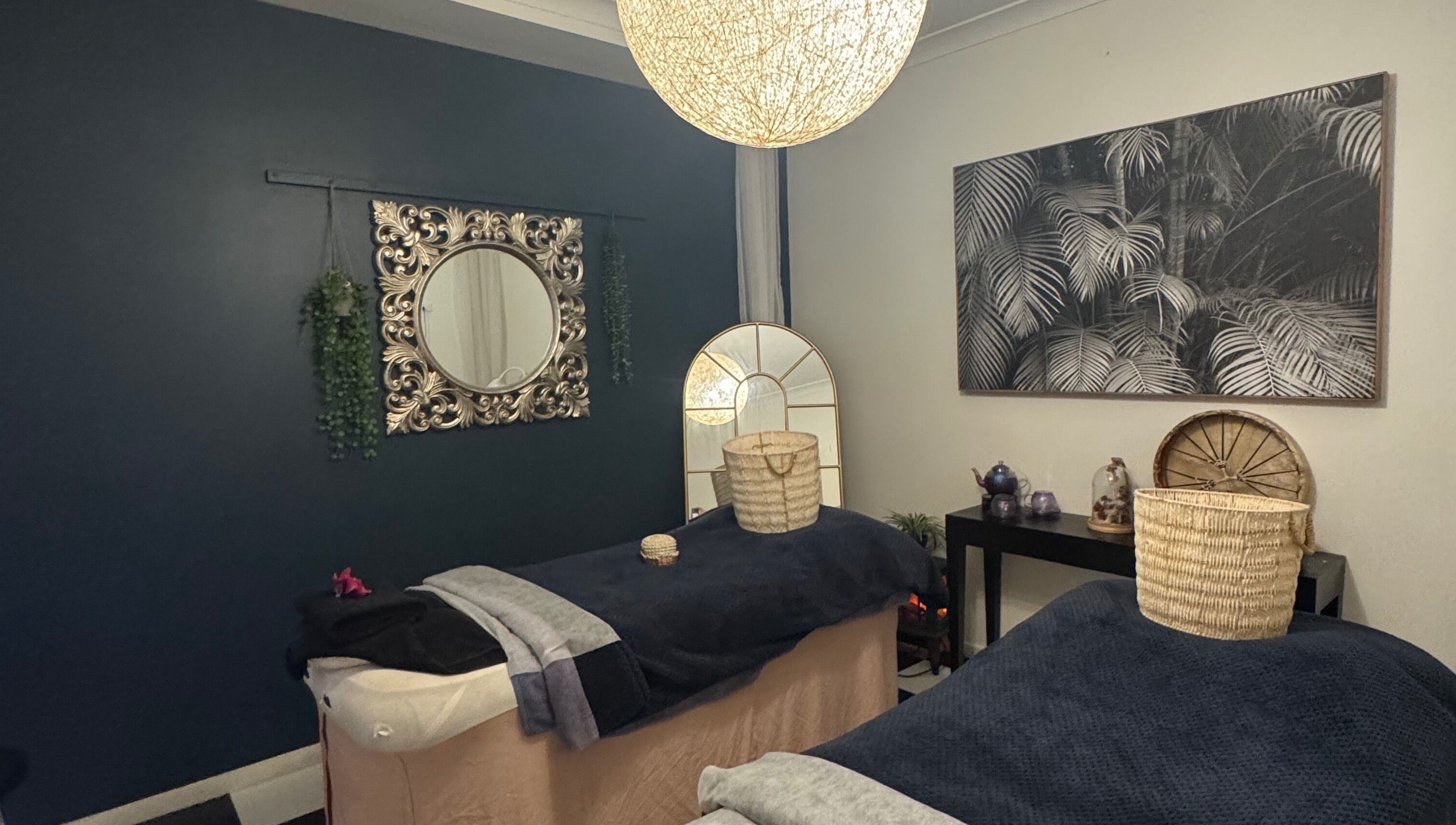 Relaxing spa room at Spa Semiyahn Skin + Body Retreat, Port Kembla, New South Wales, AU featuring elegant decor.