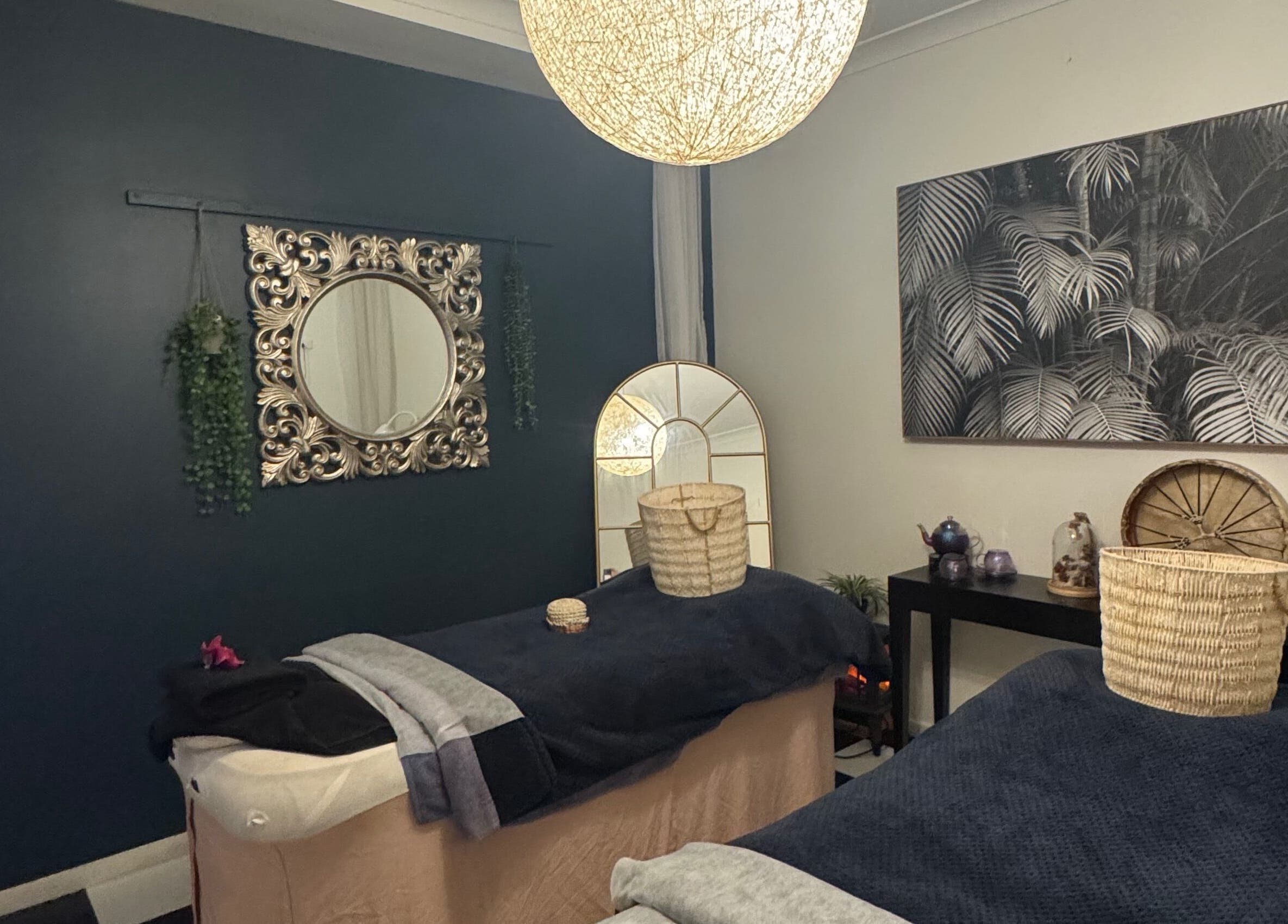 Relaxing spa room at Spa Semiyahn Skin + Body Retreat, Port Kembla, New South Wales, AU featuring elegant decor.