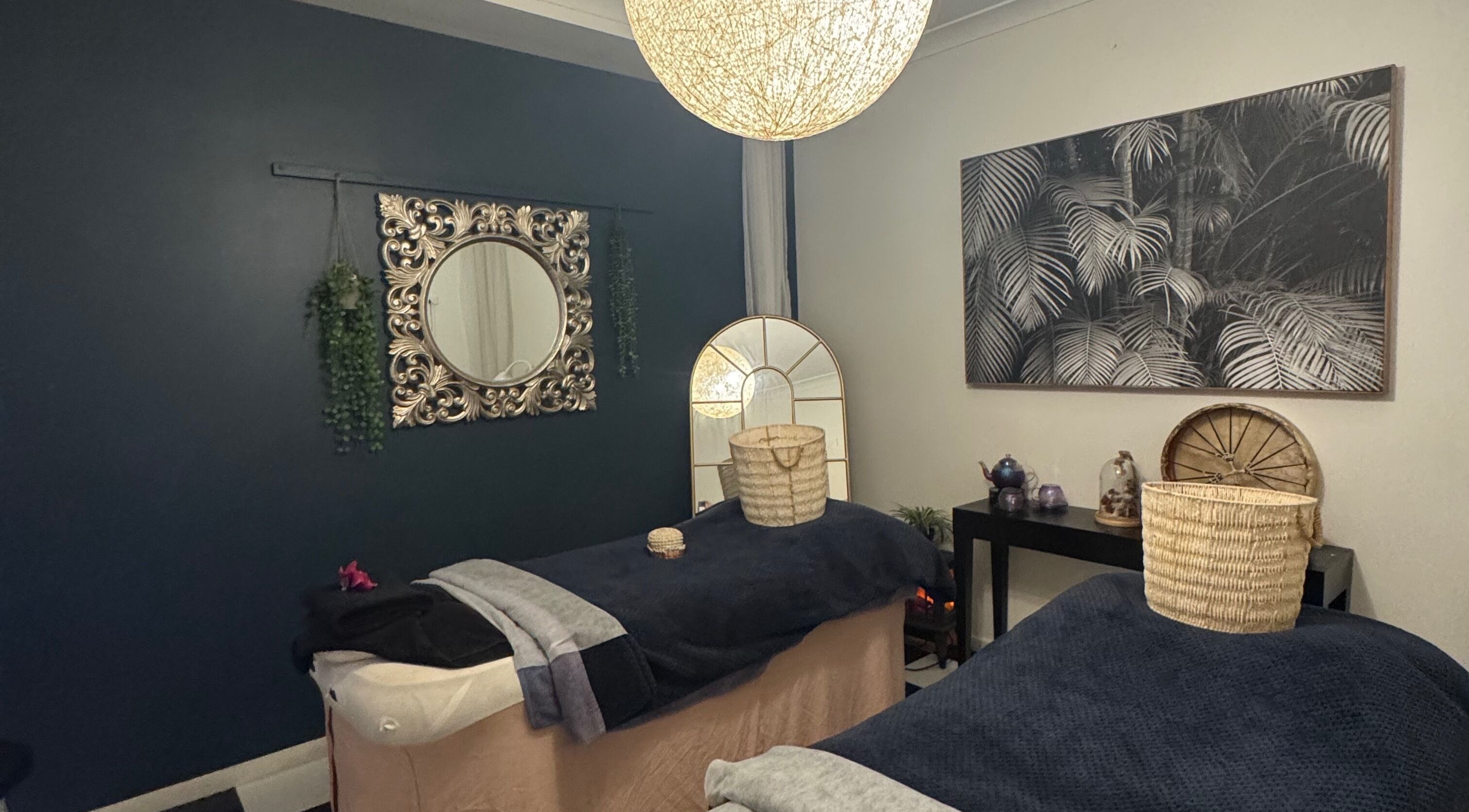 Relaxing spa room at Spa Semiyahn Skin + Body Retreat, Port Kembla, New South Wales, AU featuring elegant decor.