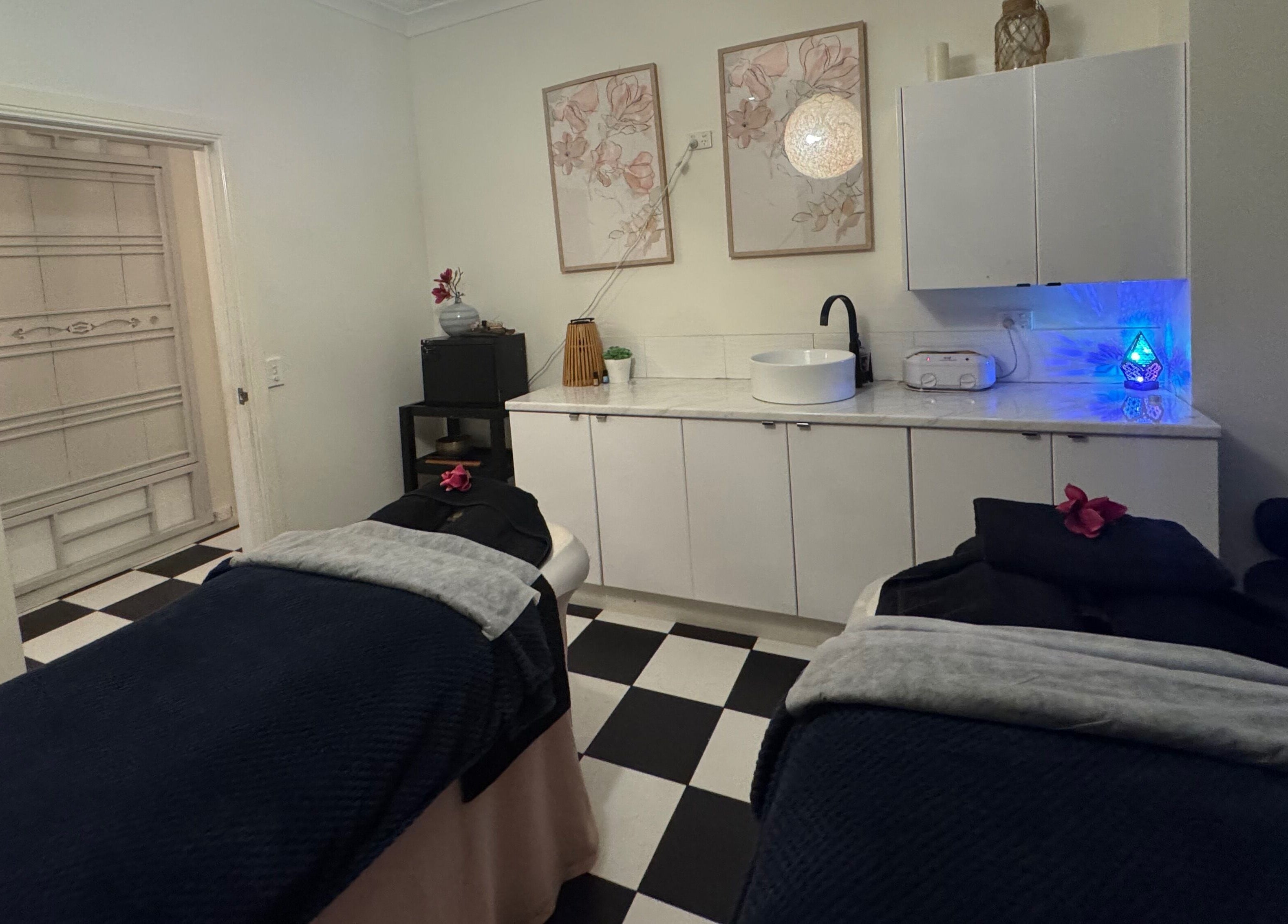 Relaxing treatment room at Spa Semiyahn Skin + Body Retreat in Port Kembla, New South Wales, AU, with massage tables.