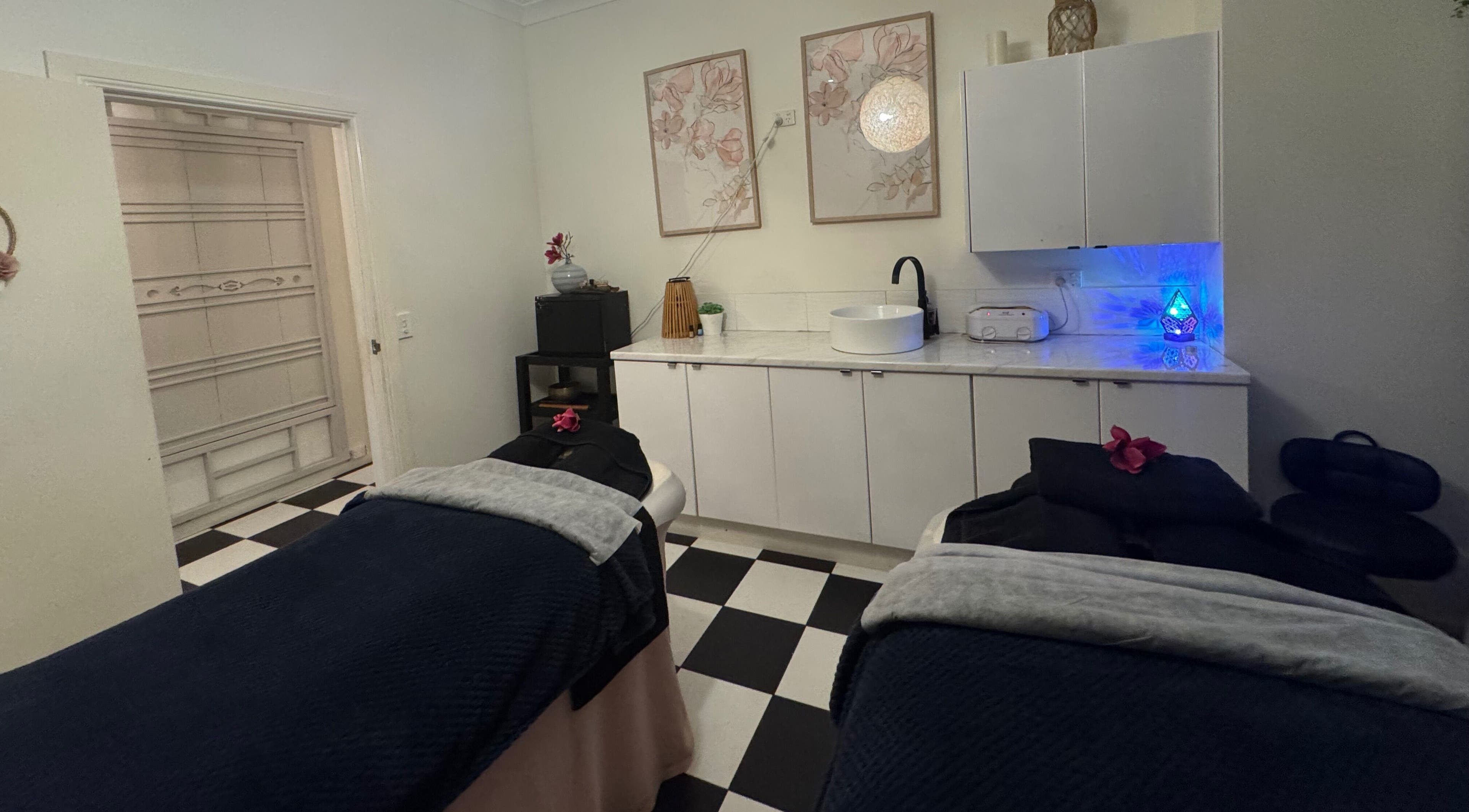Relaxing treatment room at Spa Semiyahn Skin + Body Retreat in Port Kembla, New South Wales, AU, with massage tables.