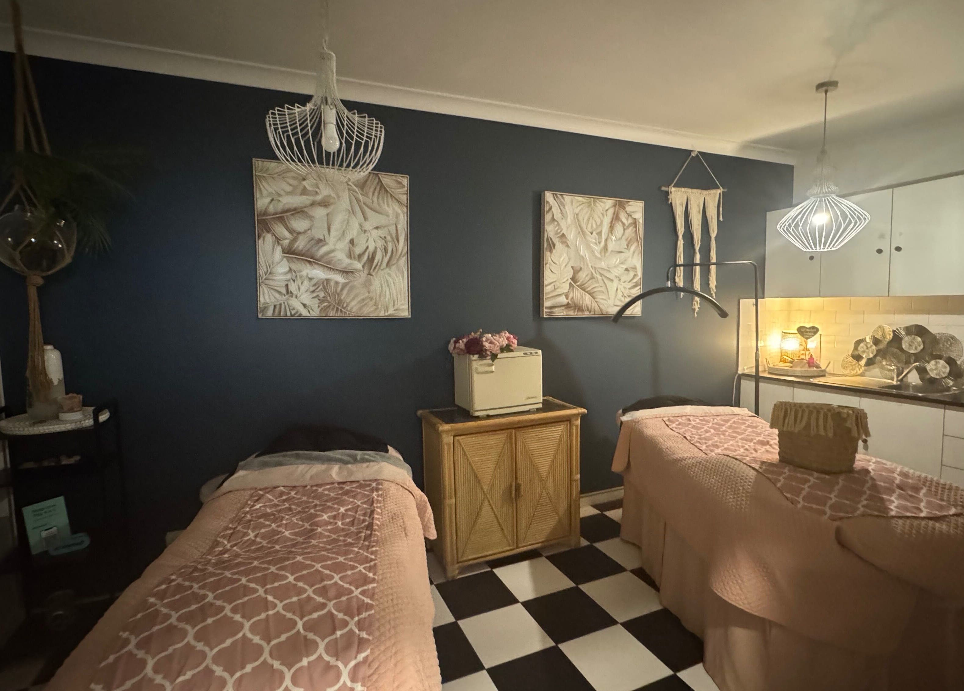 Tranquil massage room at Spa Semiyahn Skin + Body Retreat, Port Kembla, New South Wales, AU with elegant decor.