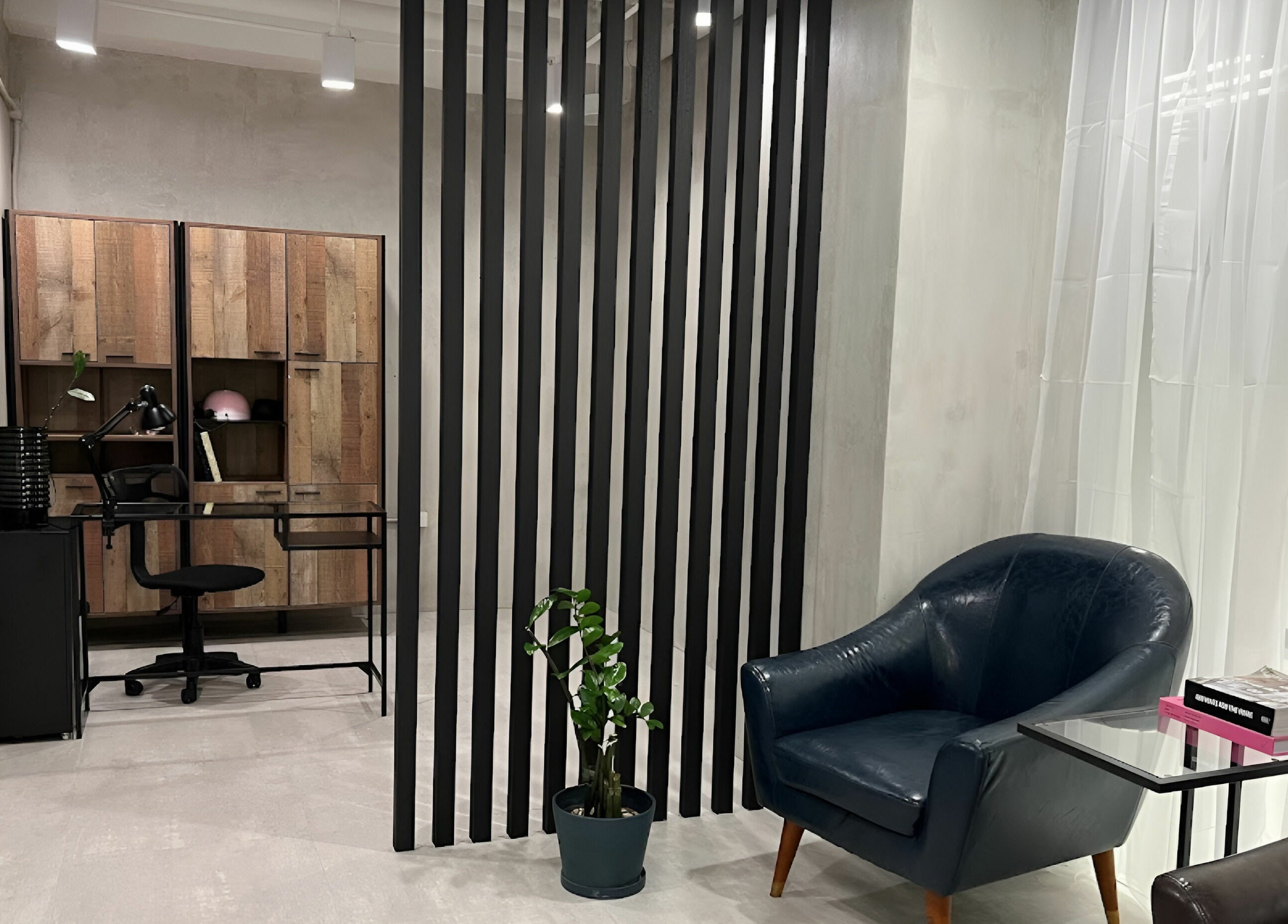 Cozy seating at Evie & Co. Manila in Makati, Metro Manila, PH featuring modern decor and leather chair.