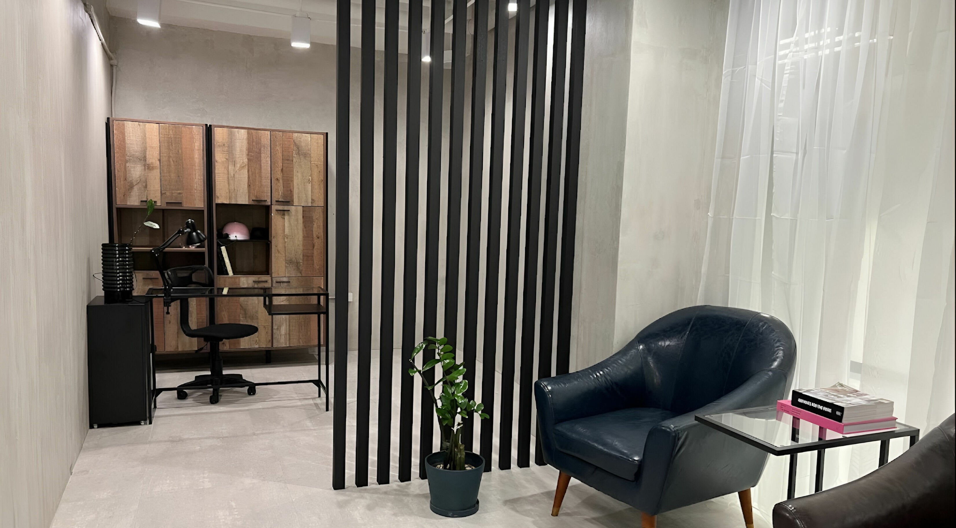 Cozy seating at Evie & Co. Manila in Makati, Metro Manila, PH featuring modern decor and leather chair.