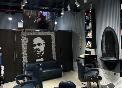 Chic interior of Milado Cut Barber Shop in Dubai, Dubai, AE, featuring modern chairs and unique decor.