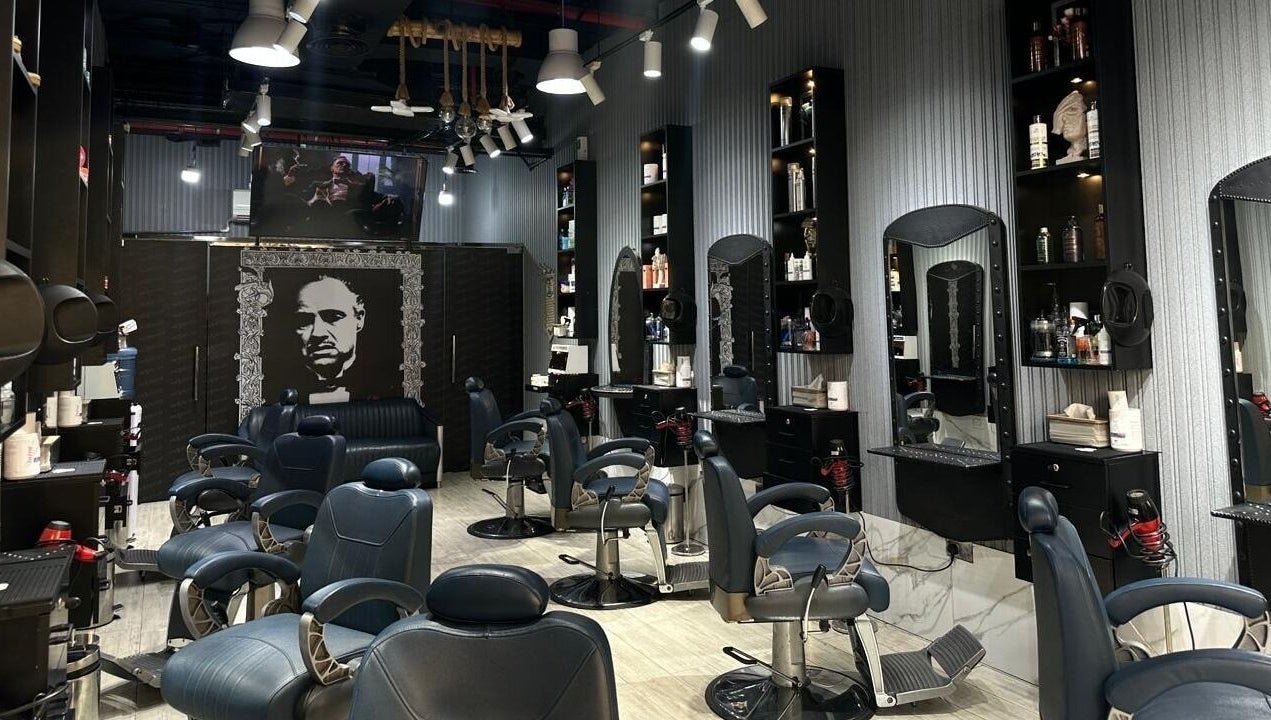 Interior of Milado Cut Barber Shop in Dubai, Dubai, AE showcasing sleek barber chairs and grooming stations.