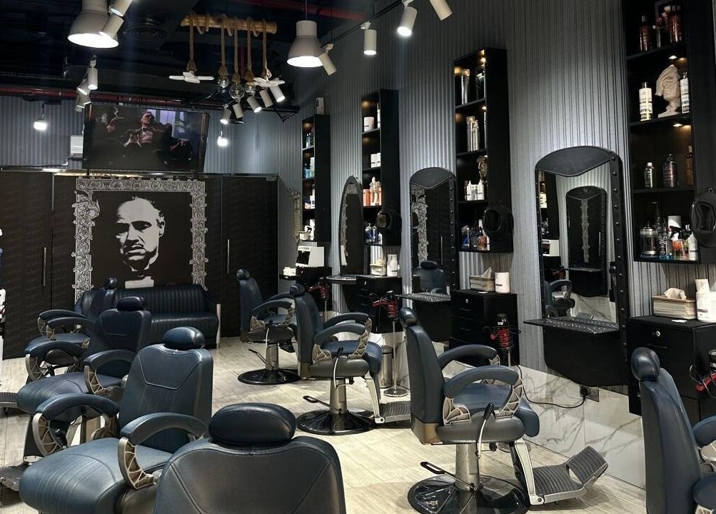 Interior of Milado Cut Barber Shop in Dubai, Dubai, AE showcasing sleek barber chairs and grooming stations.