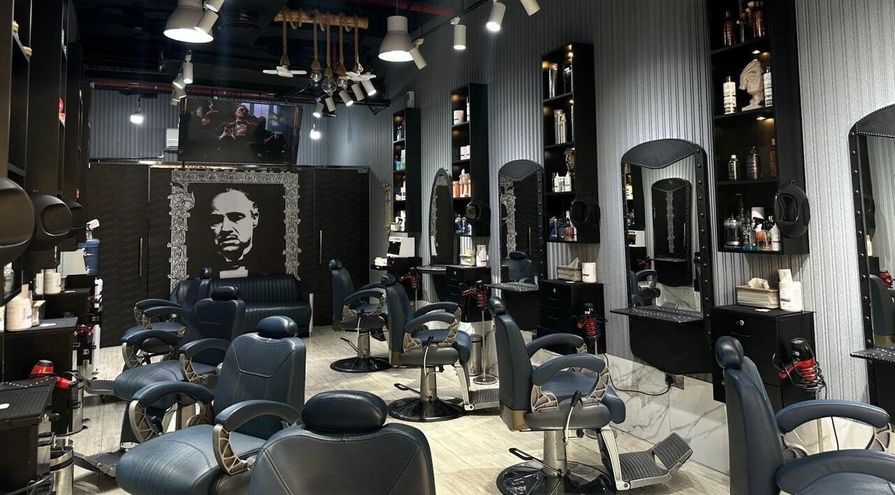 Interior of Milado Cut Barber Shop in Dubai, Dubai, AE showcasing sleek barber chairs and grooming stations.